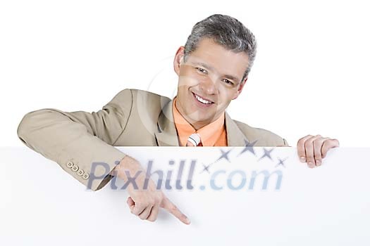 Businessman pointing his finger to the white poster