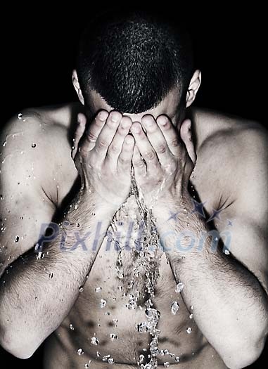 Man washing his face Man washing his face
