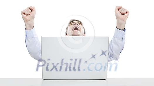 Successful businessman with hands in the air at his desk Successful businessman with hands in the air at his desk