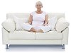 Isolated older woman sitting on the couch and meditating