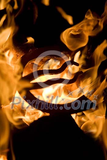 Iron being heated in the fire Iron being heated in the fire