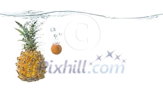Pineapple and an orange diving on to the water