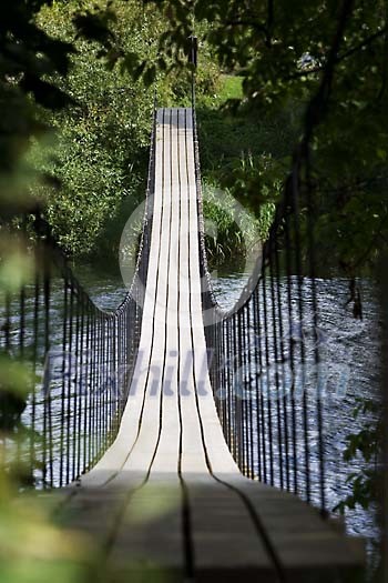 Empty wooden suspension bridge