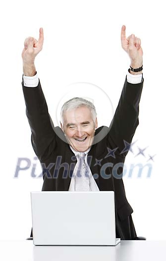 Isolated senior businessman cheering behind a laptop Isolated senior businessman cheering behind a laptop