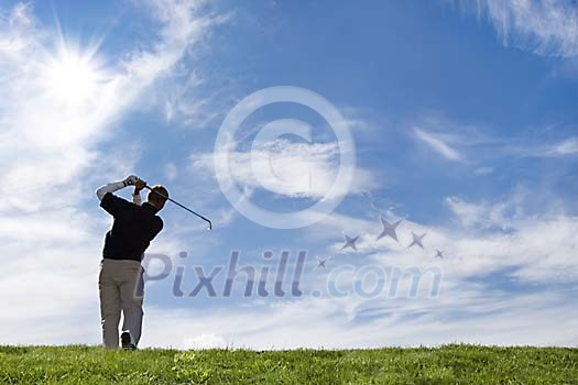 Male hitting a golf ball Male hitting a golf ball