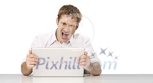 Isolated man looking mad about his laptop