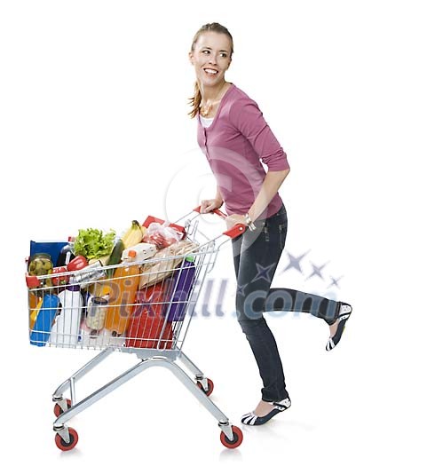 Isolated woman pushing a shopping cart full of groceries