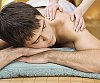 Sporty male getting shoulder massage
