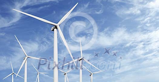 Windmill rotors against blue sky