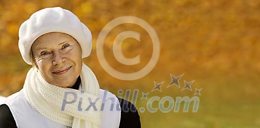 Senior lady enjoying a beautiful autumn day