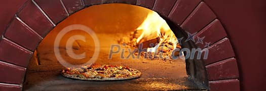 Pizza in a wood heated pizza owen Pizza in a wood heated pizza owen