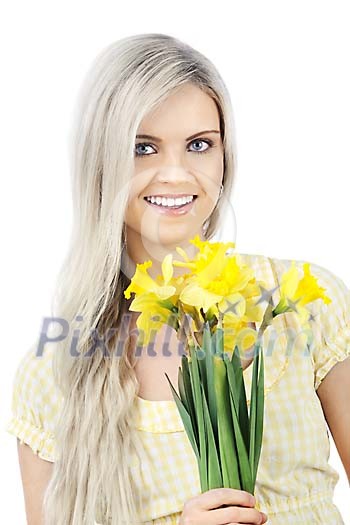 Beautiful girl holding a bouquet of narcissi