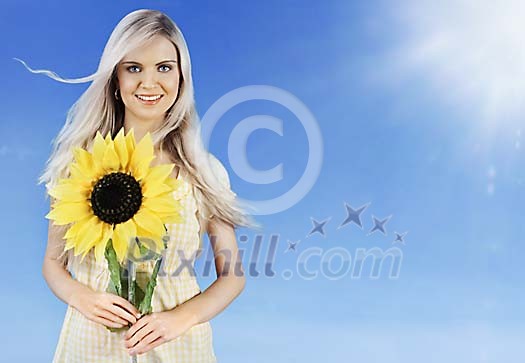Beautiful girl holding a big sunflower