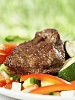 Grilled fillet of beef surrounded by vegetables