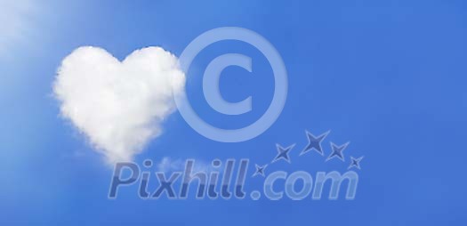 Lonely cloud in shape of heart on blue sky