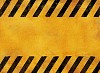 Yellow warning sign with black stripes