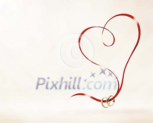 Conceptual image with heartshape and wedding rings