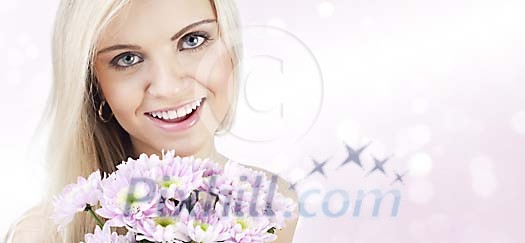 Beautiful girl with a bouquet of flowers