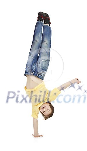 Young boy balancing with one hand