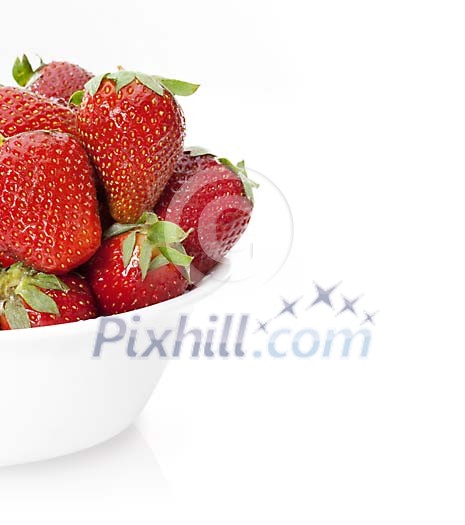 Strawberries in a bowl on white