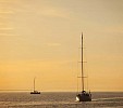 Two boats on the sea at sunset