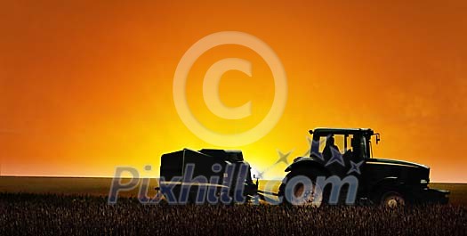 Tractor on the field in the evening darkness
