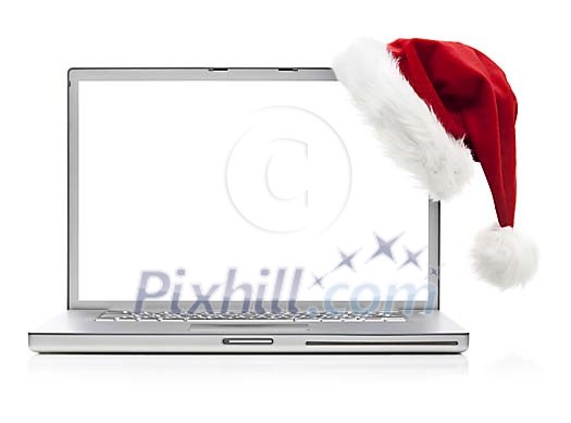 Laptop with santas hat on a white background