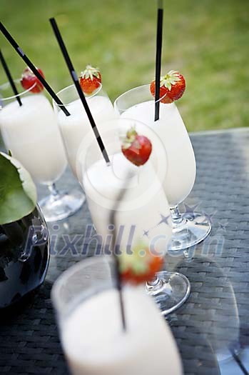 Milkshakes on a table outside Milkshakes on a table outside