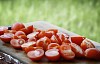 Freshly cut tomatoes on a cutting board