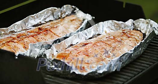 Freshly cooked fish in a foil