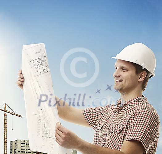 Man checking the plans at the building site