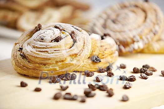 Raisin bun with raisins spread on the table