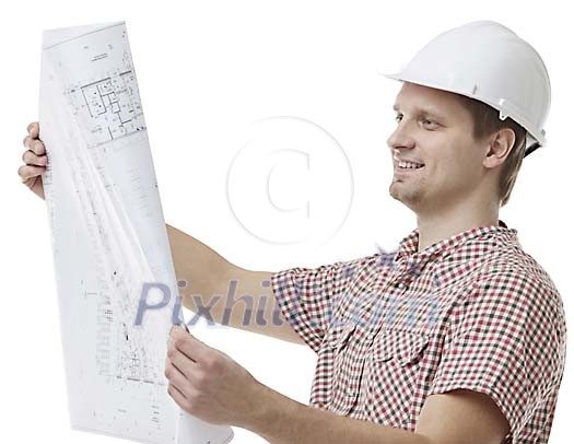 Clipped man looking at blueprints