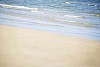 Background image of sandy beach and waves