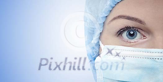 Nurses face with mouth cover and surgery hat