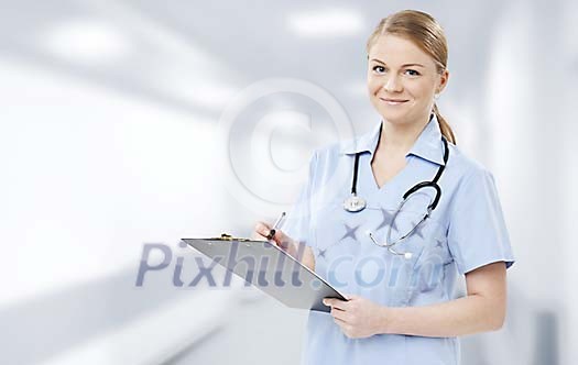 Female nurse writing down notes