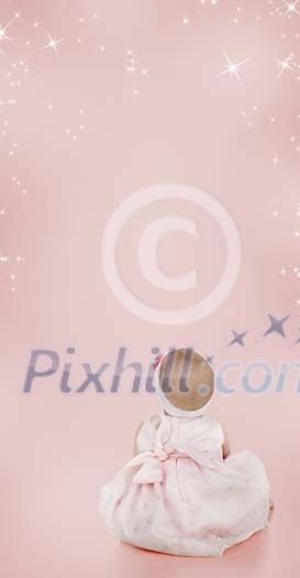 Baby girl sitting and looking at the stars on a pink background