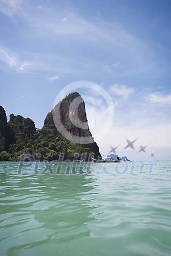 Boats at the sea and rocks on the background at Krabi, Thailand