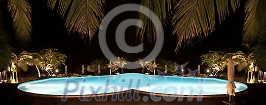 Lighted resort pool in the night