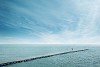 People walking on a very long pier