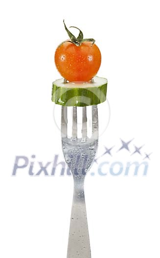 Clipped fork with a tomato and slice of cucumber