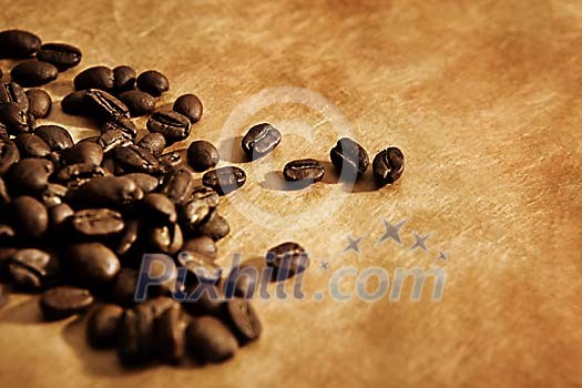 Brown paper and brown coffee beans Brown paper and brown coffee beans