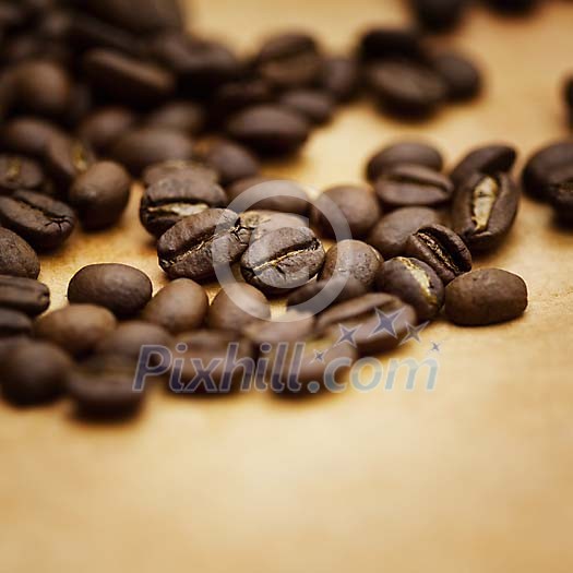 Closeup of a coffee beans on a brown paper