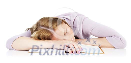 Woman sleeping over a book