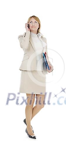 Clipped businesswoman walking and talking to a phone