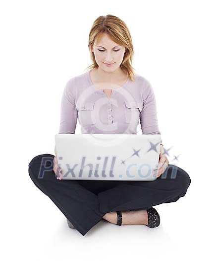 Clipped woman sitting on the floor, holding a laptop
