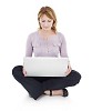 Clipped woman sitting on the floor, holding a laptop