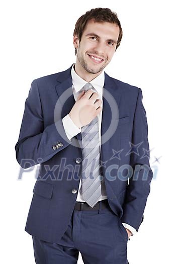 Clipped businessman fixing his tie