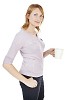 Casually dressed woman standing and holding a white cup. Clipping path included