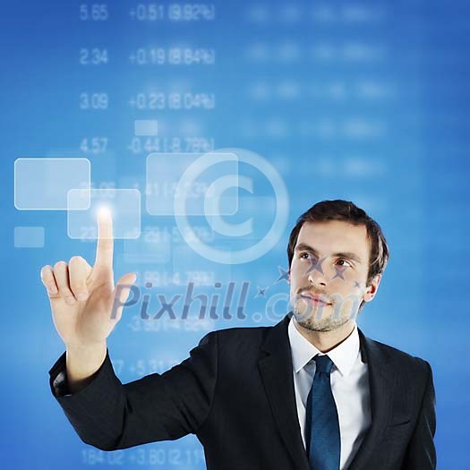 Businessman touching a virtual touchscreen Businessman touching a virtual touchscreen